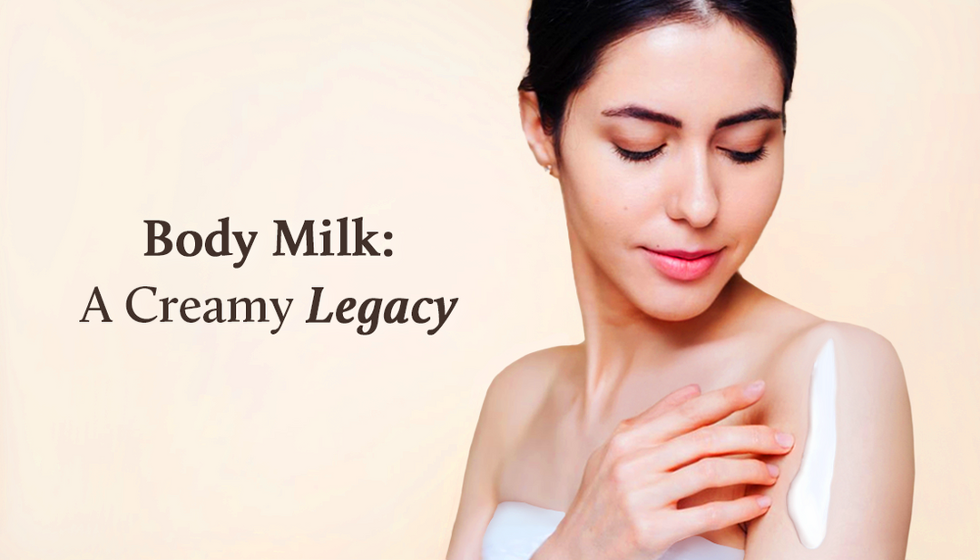The lady has applied body milk to her shoulder and gently rested her other hand on it.