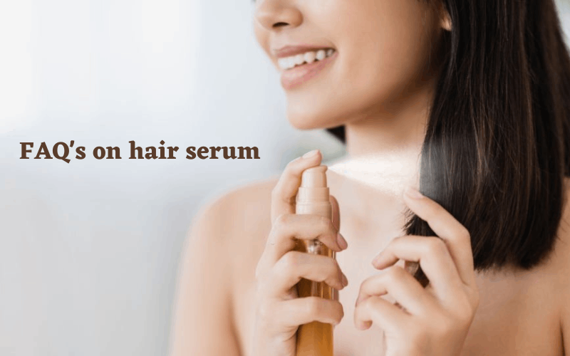 lady is applying hair serum on her hair