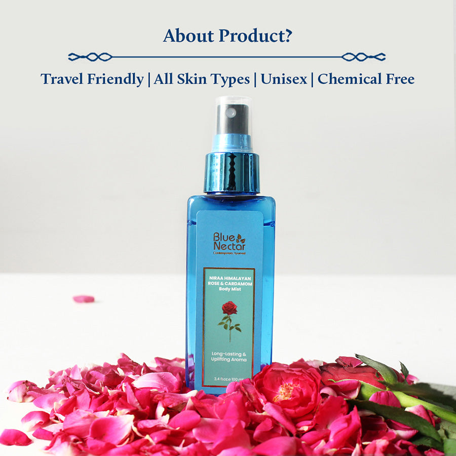 The Rose Body Mist is placed on a white table with rose petals arranged in front of it.