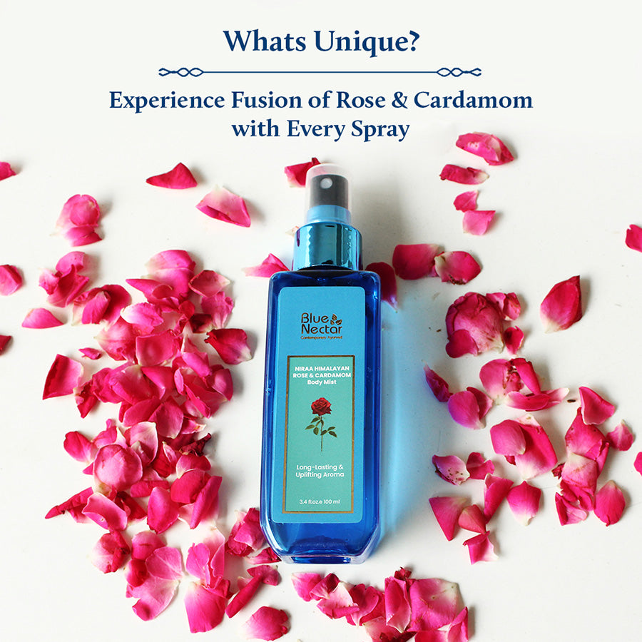 Blue nectar rose body mist is on white table with rose petals around